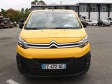 a small yellow van parked in a parking lot