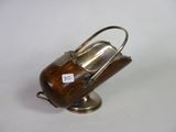 an antique silver plated teapot on a stand with a tag on it