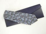 a tie that is laying on top of an envelope