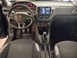 the interior of a small car with a steering wheel and dashboard