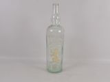 a small glass bottle with a yellow flower inside of it