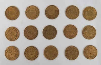 a close up of a bunch of coins on a white surface