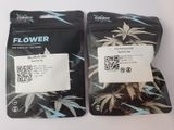 two bags of cannabis seeds sitting on a table
