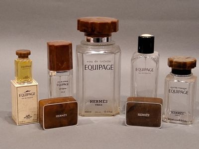 several bottles of perfume sitting next to each other on a table