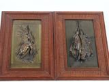 une paire de tableaux dans des cadres en bronze représentant un chien et un canard