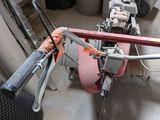 a machine that is sitting on the floor next to a tire