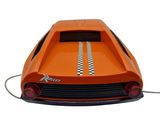 an orange toy car that is connected to a charger