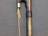 a wooden stick and a wooden stick on a black surface