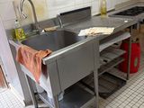 a kitchen with a sink and a stove in it