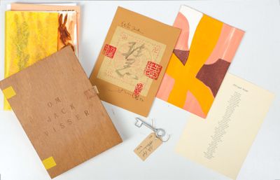 many different types of cards and envelopes laid out on a table