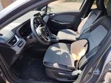 the interior of a car with the door open and the driver ' s seat down