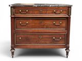 an antique chest of drawers with marble top