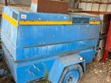 a blue trailer with a box on the back of it