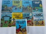 six livres pour enfants français exposés sur une surface blanche