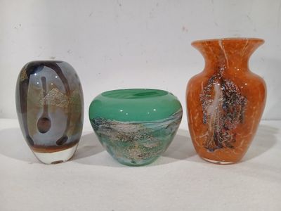three vases sitting next to each other on a table