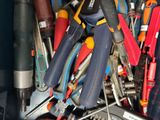 a lot of tools that are sitting in a container