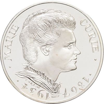 an image of a close up of a coin with a woman ' s face on it