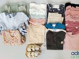 a pile of clothes and shoes on a table