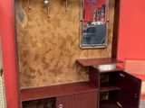 a wooden cabinet with a mirror and a mirror on the wall