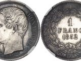 Gros plan sur une pièce de monnaie portant le visage d'un homme