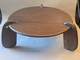 a small wooden table with a handle on it
