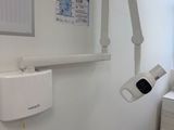 an image of a hospital room with a bed and a monitor