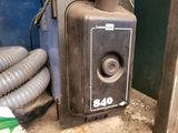 a black machine that is sitting on the ground