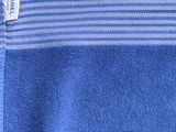 blue and white striped towel with a tag on it