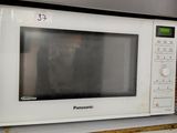 a white microwave sitting on top of a counter