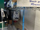 a metal rack with a sign on it in a room