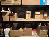many boxes and boxes on a shelf in a room