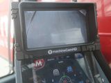 a close up view of a vehicle ' s dashboard with a monitor