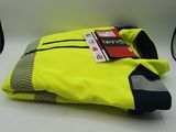 a yellow bag with a tag on it sitting on a table