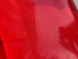 a close up of a red plastic bag on a table