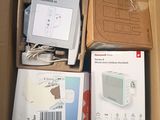 a box full of electronic devices and a box of other items