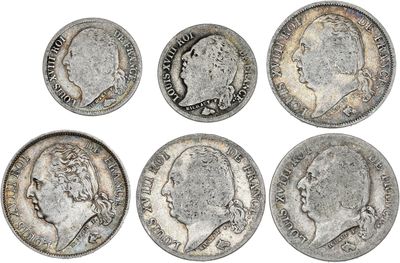 six types différents de pièces d'argent sur fond blanc