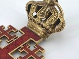 an image of a gold and red cross with a crown on top