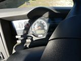 a close up of a car dashboard with a speedometer