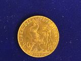 an image of a gold coin on a blue surface