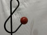 a picture of a metal sculpture of planets on a stand