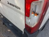 a close up of the tail light of a white truck