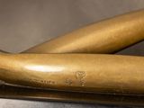 two baseball bats sitting on top of a table