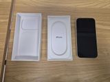 an apple iphone is sitting next to an empty box on a table