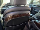 the interior of a car with leather seats and a center console