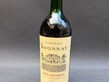 a close up of a bottle of wine on a table