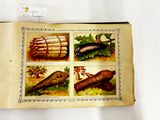 a picture of a book with pictures of animals and plants