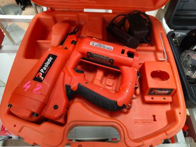 an orange tool box with tools in it on a table