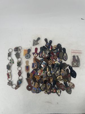 a pile of badges and other items on a table
