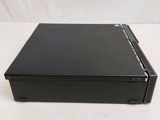 a close up of a small black computer on a white surface