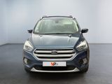 the front view of a blue ford kuga parked in a room